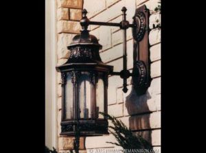 36" Tall Wall Sconces in Fabricated bronze with Custom Castings.