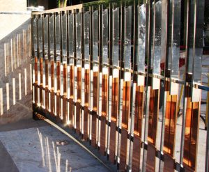 Copper and Stainless Drive Gate and Fence. Beverly Hills, CA. Cantilevered Hardware for Sliding Gates.