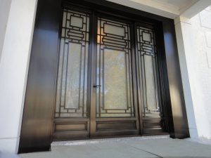 Monumental Bronze Entry Door with Sidelights.